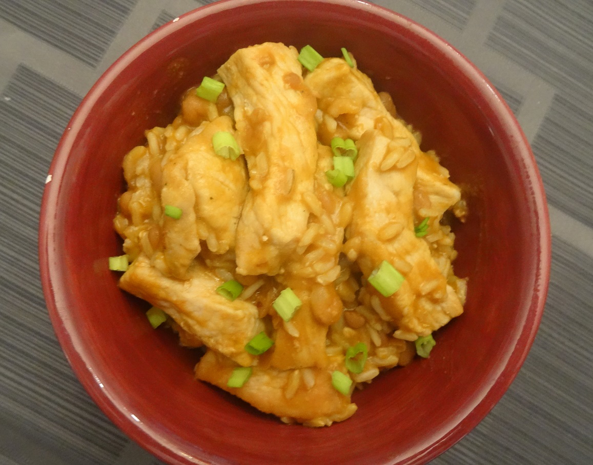 Pork with baked beans and rice