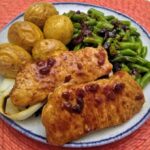 Sweet Fig glazed pork chops with roasted potatoes and onions.