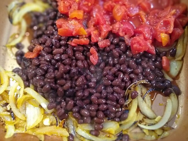 Add in the black beans and diced tomatoes