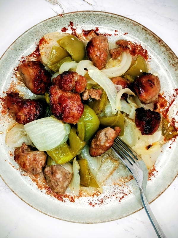 Italian sausage sheet pan dinner plate with fork